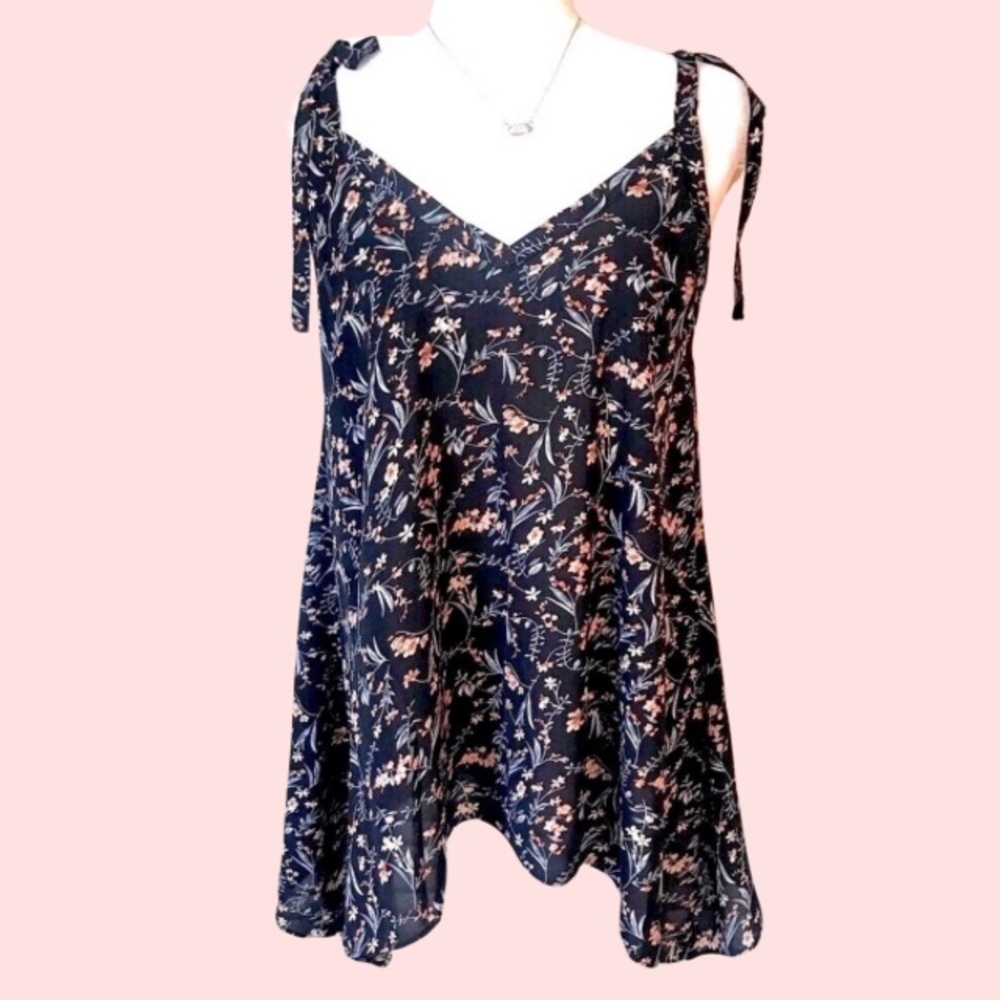 BOUTIQUE ITEM- FLORAL BLACK TANK TOP WITH SHARK BITE HEM